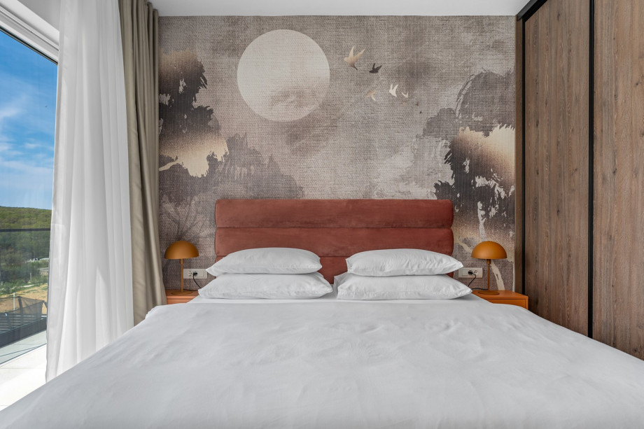 The Bedroom NO4 with a king size bed, A/C, a TV, an en-suite bathroom with a shower, and a terrace overlooking the pool and natural surroundings