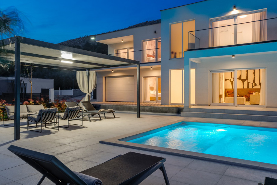a covered lounge area at night