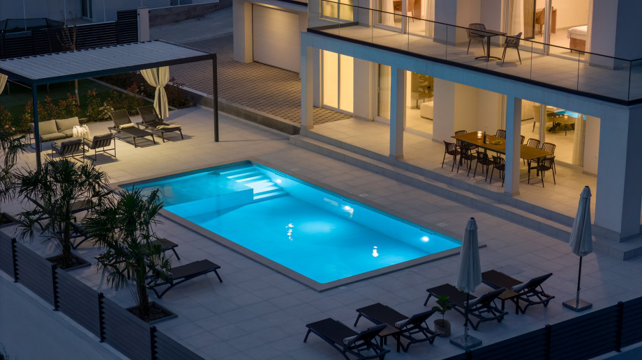 night view of the villa and the pool area