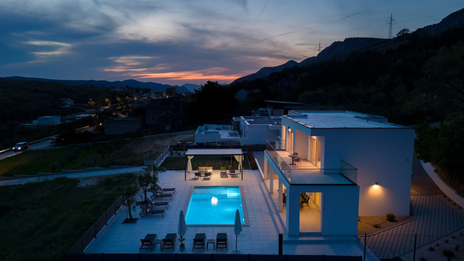 night view of the villa and the pool area