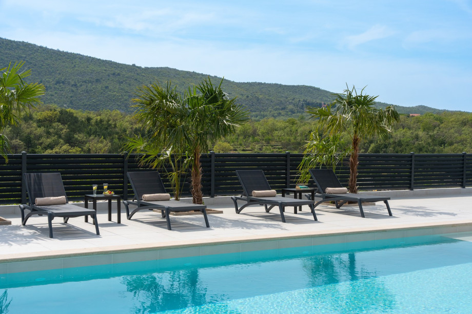 ten loungers on the inviting sun deck