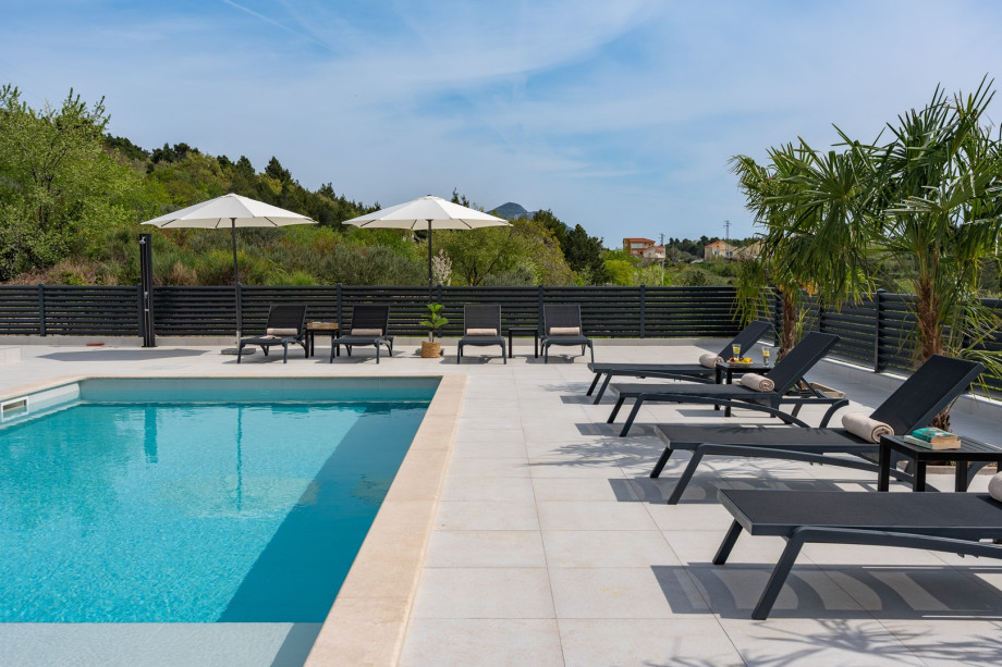ten loungers on the inviting sun deck