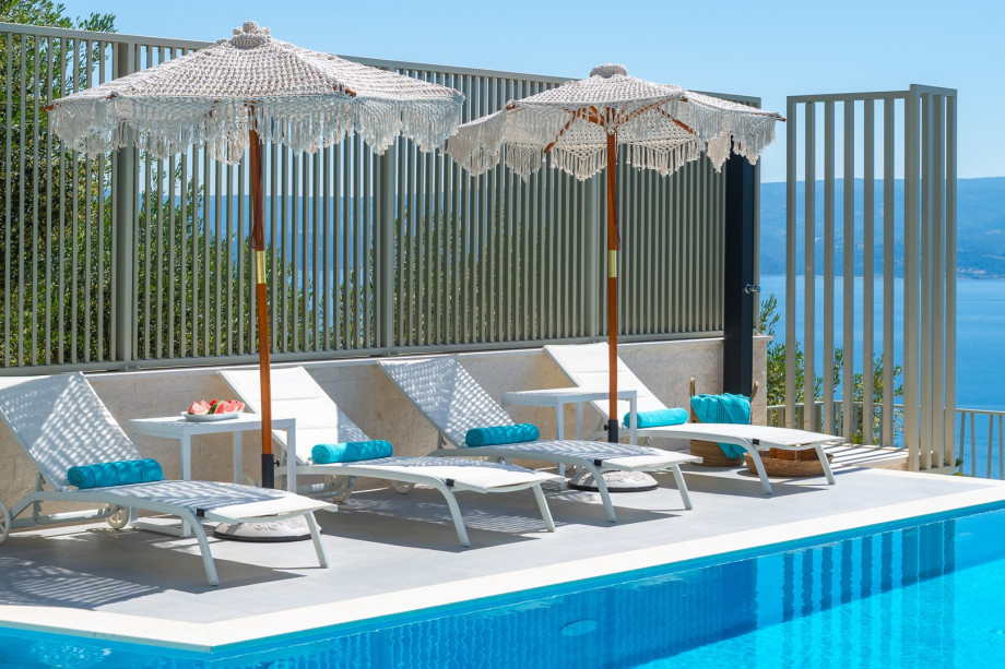 Adjacent to the pool is a sun deck with 4+2 loungers