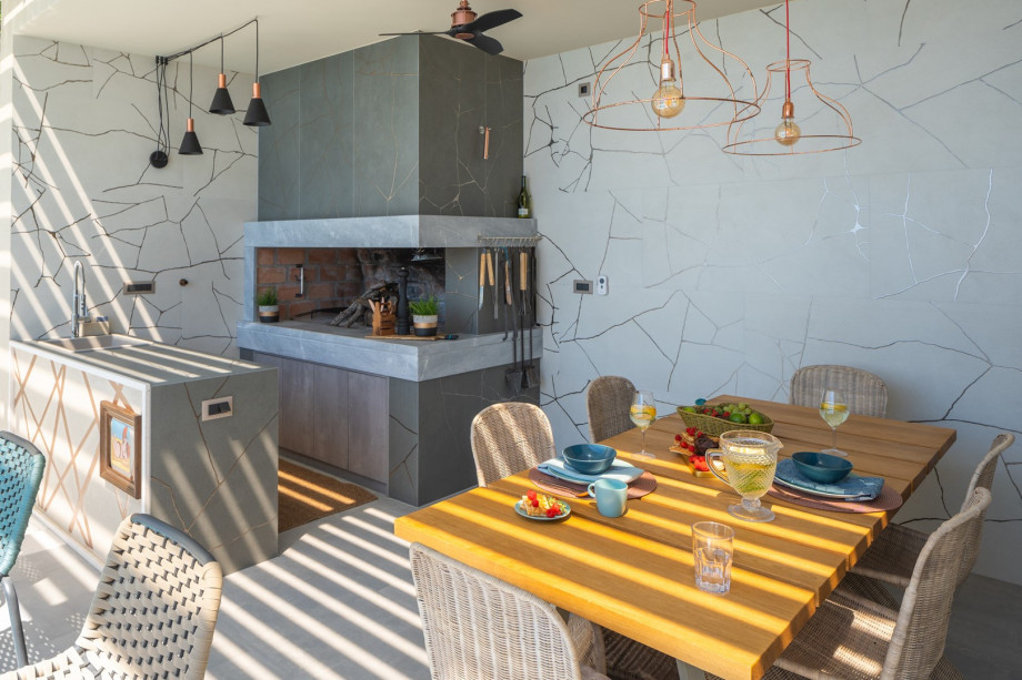 Perfect for enjoying meals outdoors while taking in the breathtaking views of the pool and the sea