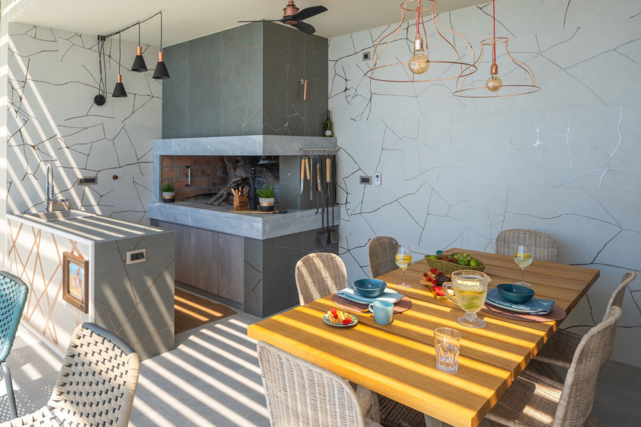 Perfect for enjoying meals outdoors while taking in the breathtaking views of the pool and the sea