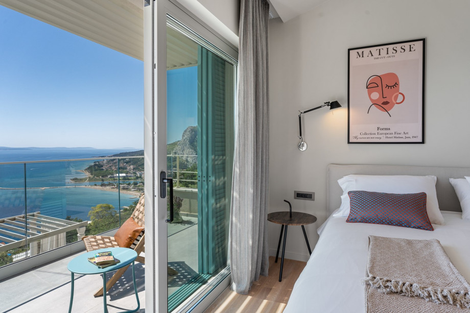 A balcony offering panoramic sea views that is shared with Bedroom 2