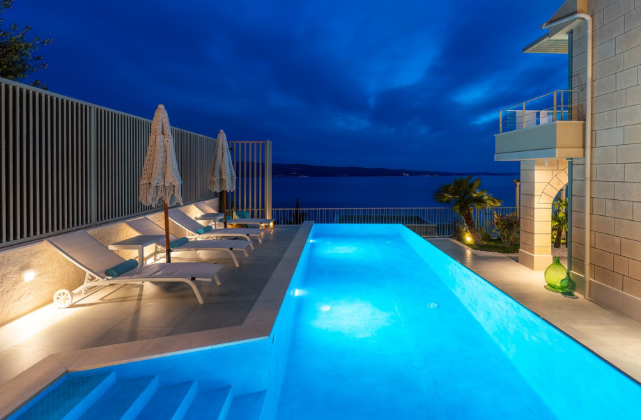 Adjacent to the pool is a sun deck with 4+2 loungers.