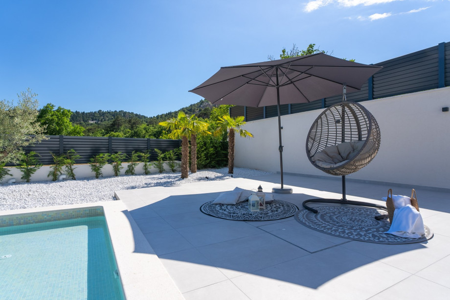 perfect place to unwind in the swing chair, lounge in the corner, and enjoy the sun