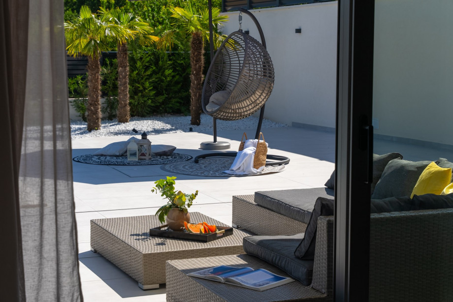 perfect place to unwind in the swing chair, lounge in the corner, and enjoy the sun