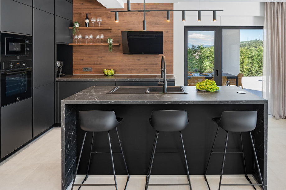 a fully furnished kitchen with an island