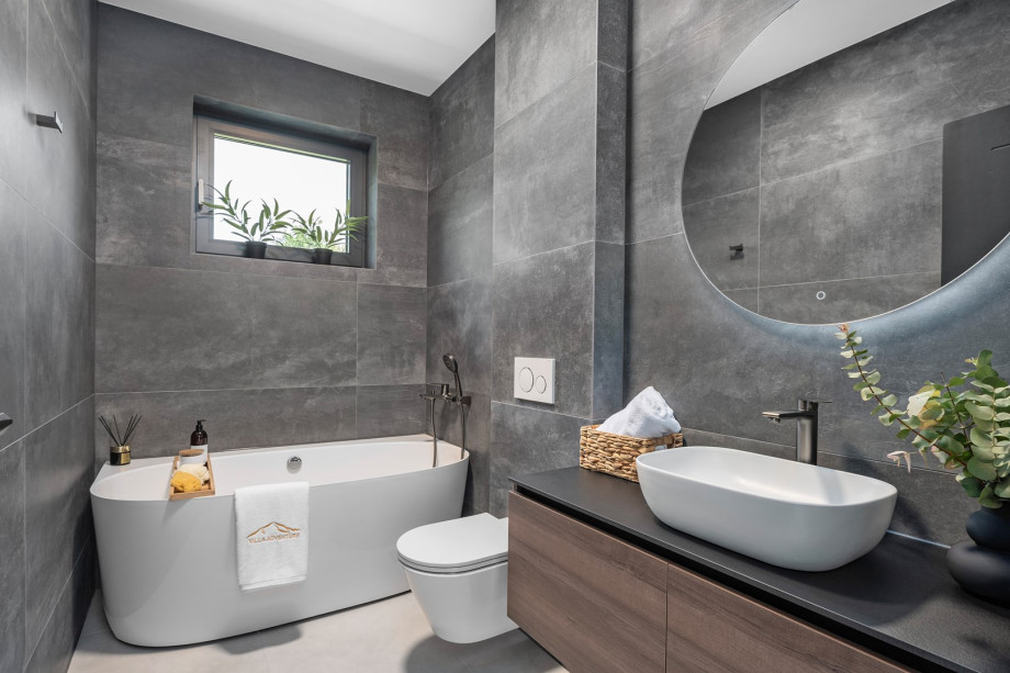 ensuite bathroom with a bathtub