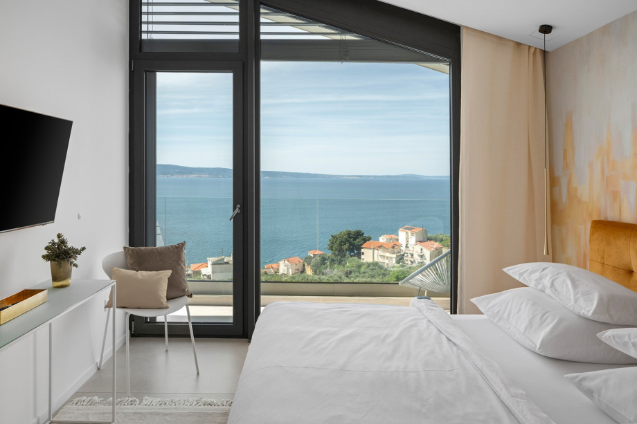 Bedroom NO3 with king-size bed, A/C, TV, balcony with views of the pool and sea