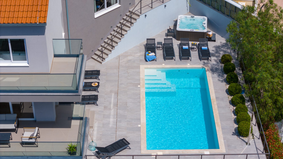 Private 32msq pool with 7 comfortable lounge chairs, and whirlpool