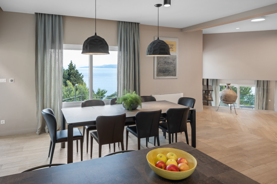 Comfortable dining area for 8 people with an exit to the outdoor dining area