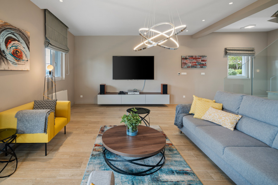 There is also a very comfortable and elegant couch, flat screen TV, free WiFi