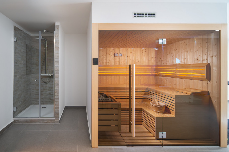 Sauna with shower on the lowest floor, next to the gym