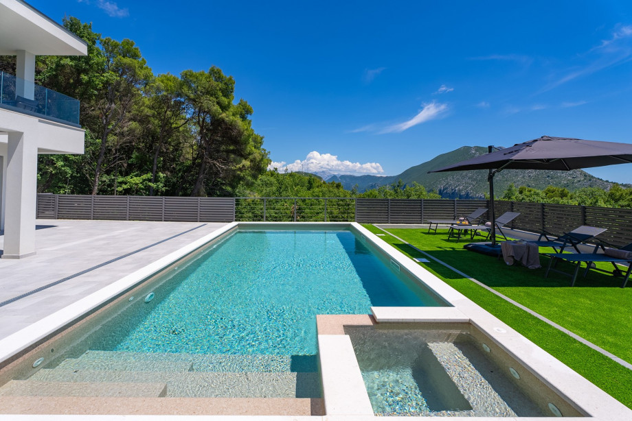 The villa has a heated pool with a fully automated salt electrolysis system