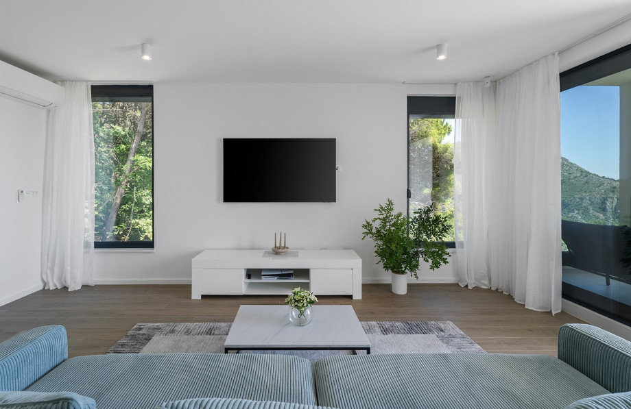 The villa has a living room with views of the magnificent mountain