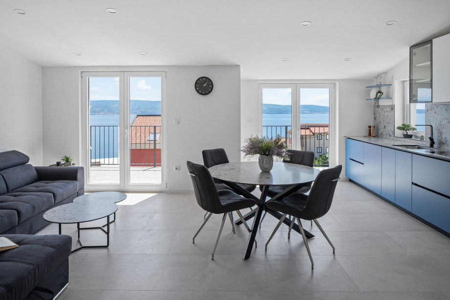 Open concept living area and a balcony with sea views