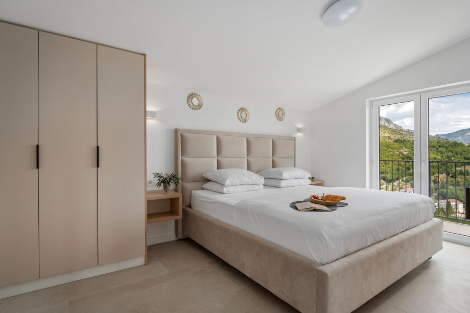 Bedroom NO6 (16sqm) with a super king size bed 200cm x 200cm, TV,A/C, a balcony with sea views