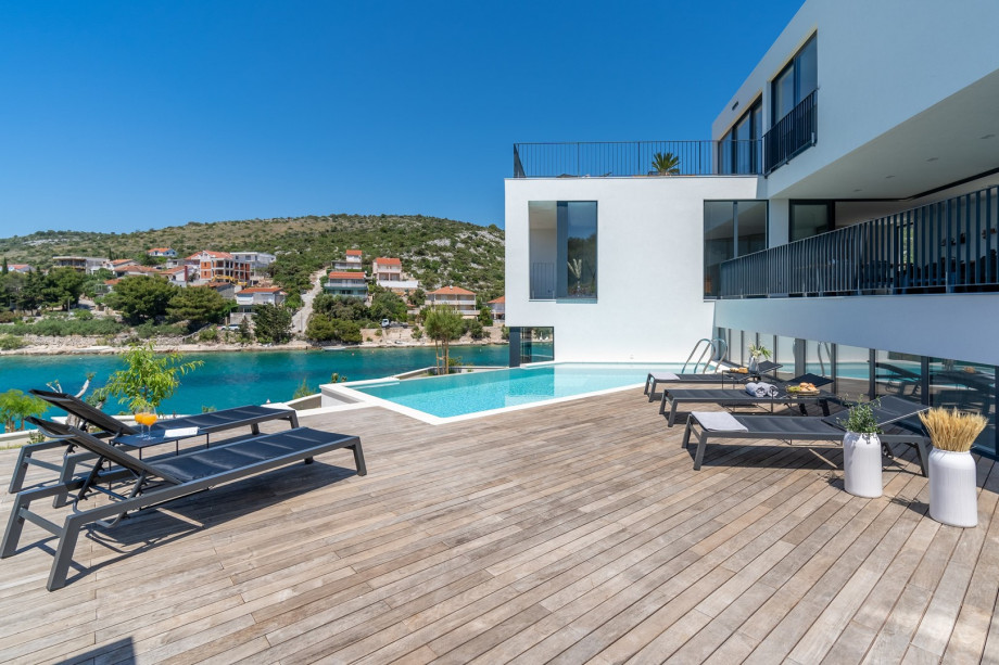 From the covered private parking lot that can take 3 cars, + 2 places on a private open plot