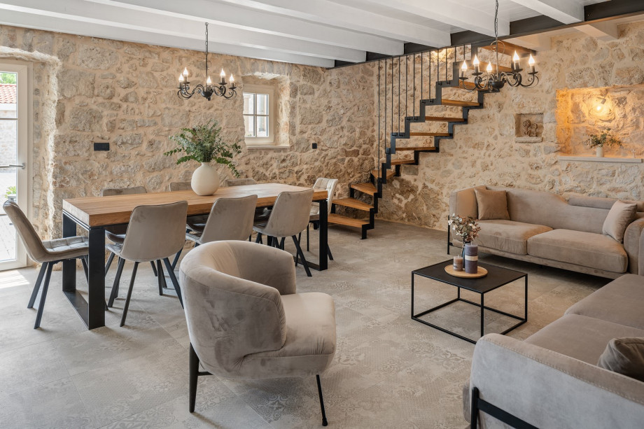 Living room and a  dining area are connected by an open-plan layout