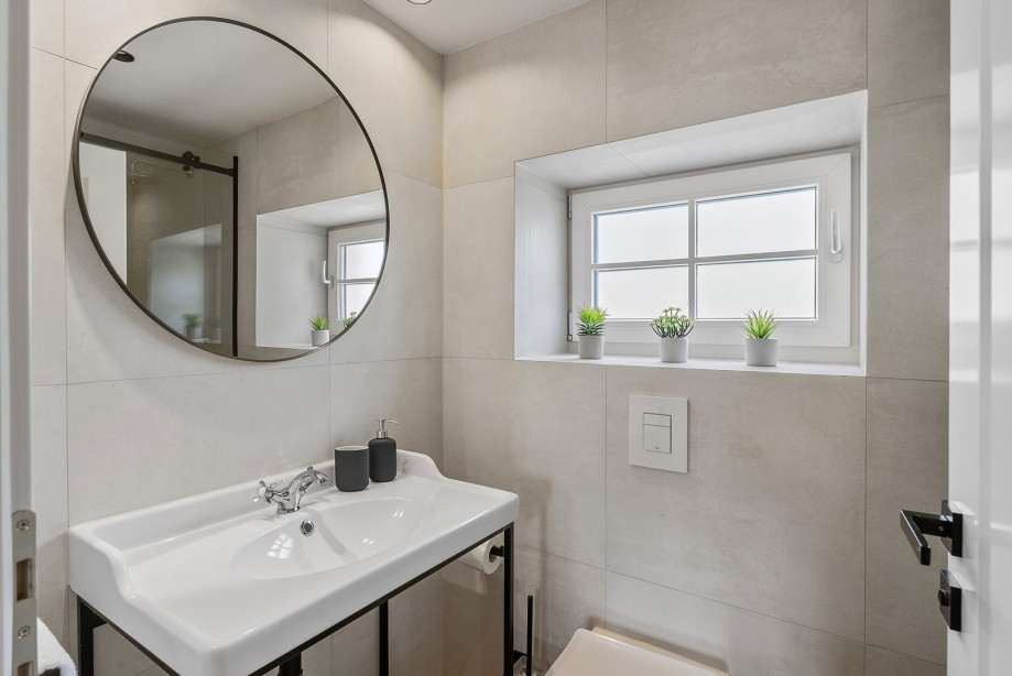 Bedrooms No. 1 and No. 2 share a stylish family bathroom with a refreshing shower.