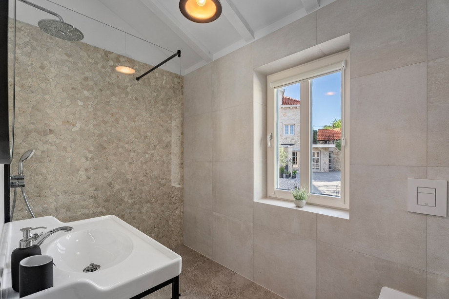 A family bathroom with a shower.