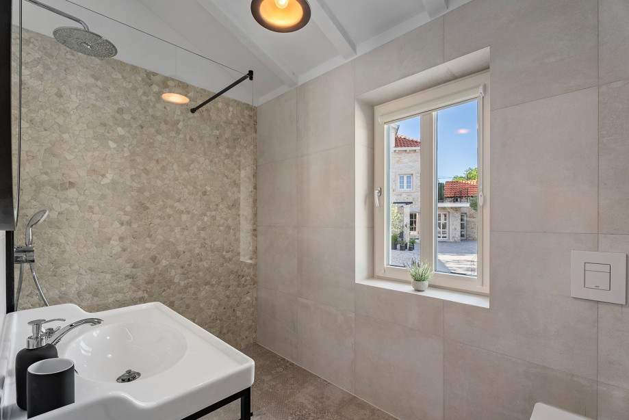A family bathroom with a shower.