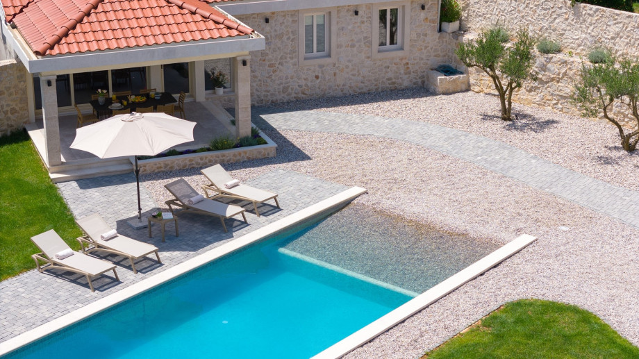 Experience the charm of the Holiday Stone Villa Mara, a delightful retreat nestled on a 900 sqm fenced private plot