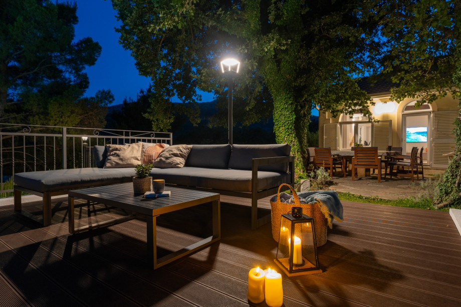 Carefully organized lights around the stone table and grassplot