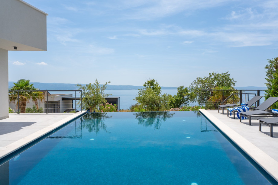 A fully air-conditioned four-bedroom villa with panoramic sea and island views from the entire property