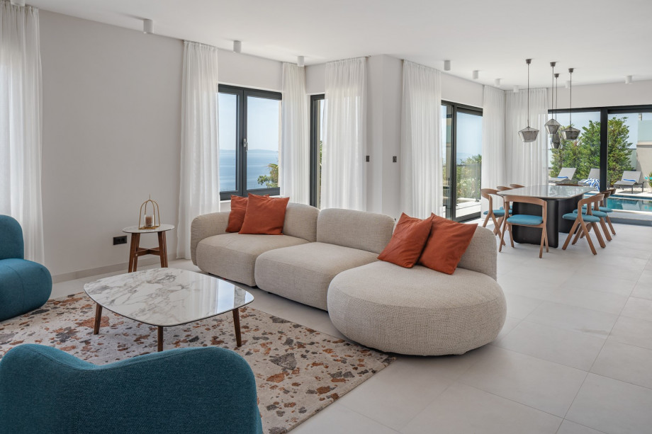 Flat-screen TV, A/C, a fireplace, sofas, direct exit to a covered outdoor dining area and pool