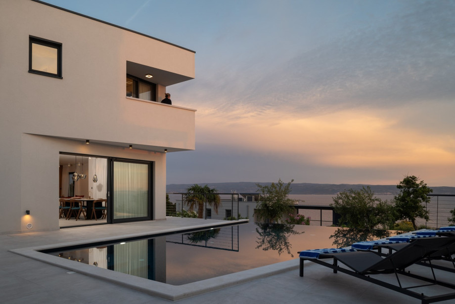 There exists a secured parking area on a private plot that can accommodate four vehicles