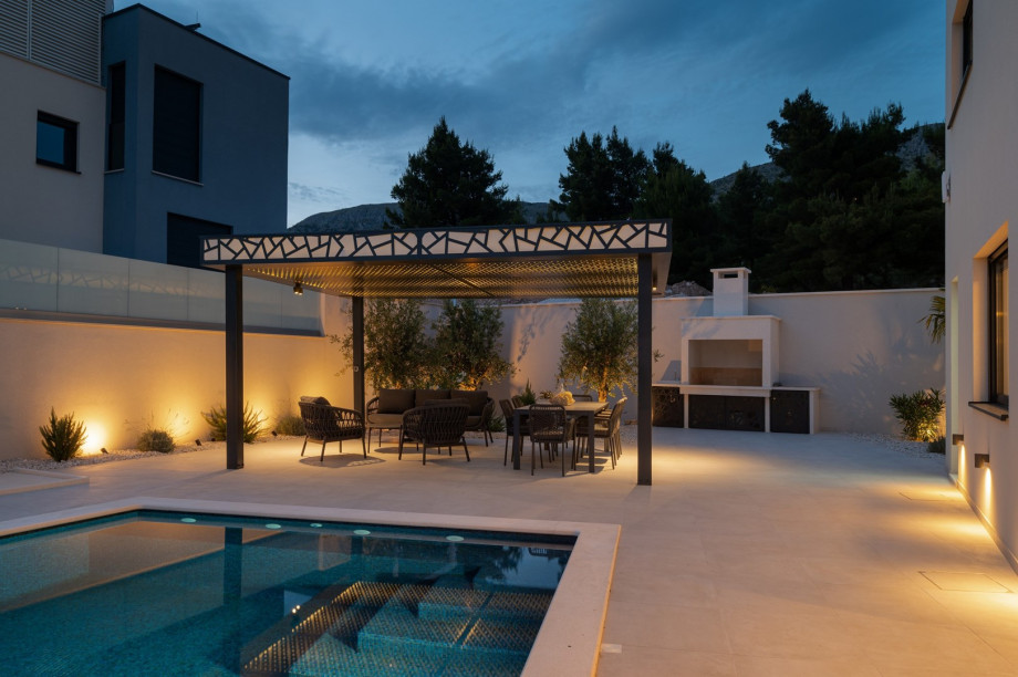 There is a covered dining area for 8 people with very comfortable chairs, and a lounge corner with open sea views