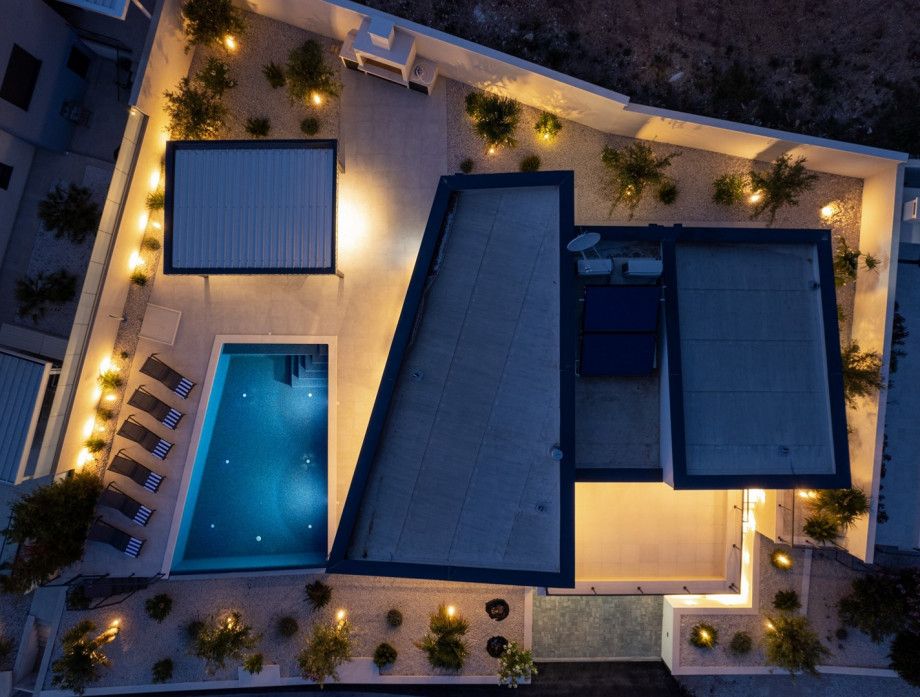 A fully air-conditioned four-bedroom villa with panoramic sea and island views from the entire property