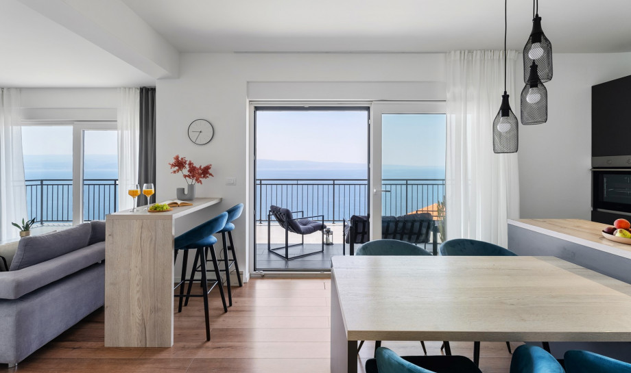 Open plan living area with fully equipped kitchen with a modern kitchen island