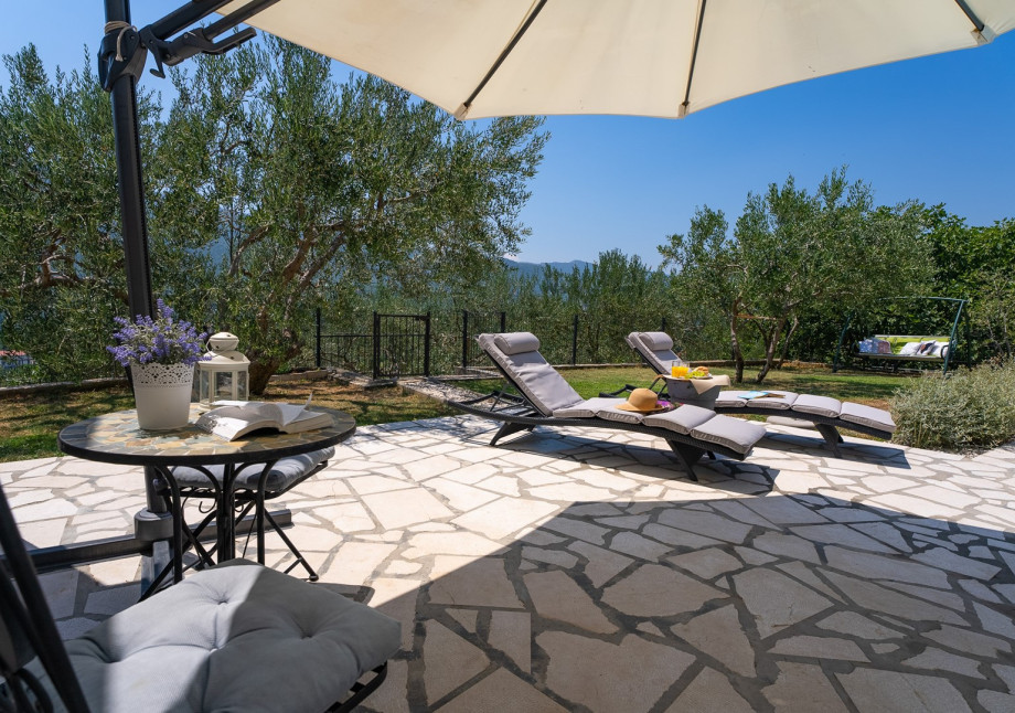 Sun deck area with 4 deck chairs and private pool