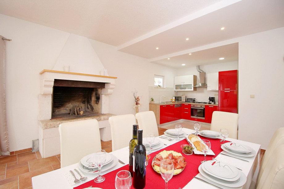Dinning and living area with fully equipped kitchen and access to the pool