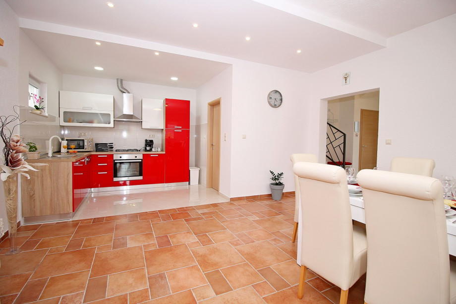 Dinning and living area with fully equipped kitchen and access to the pool