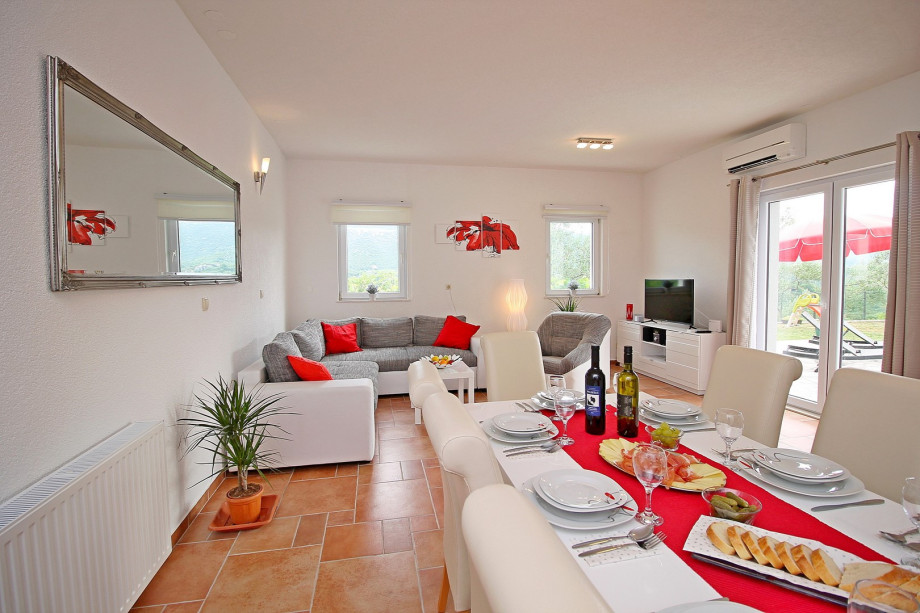 Dinning and living area with fully equipped kitchen and access to the pool