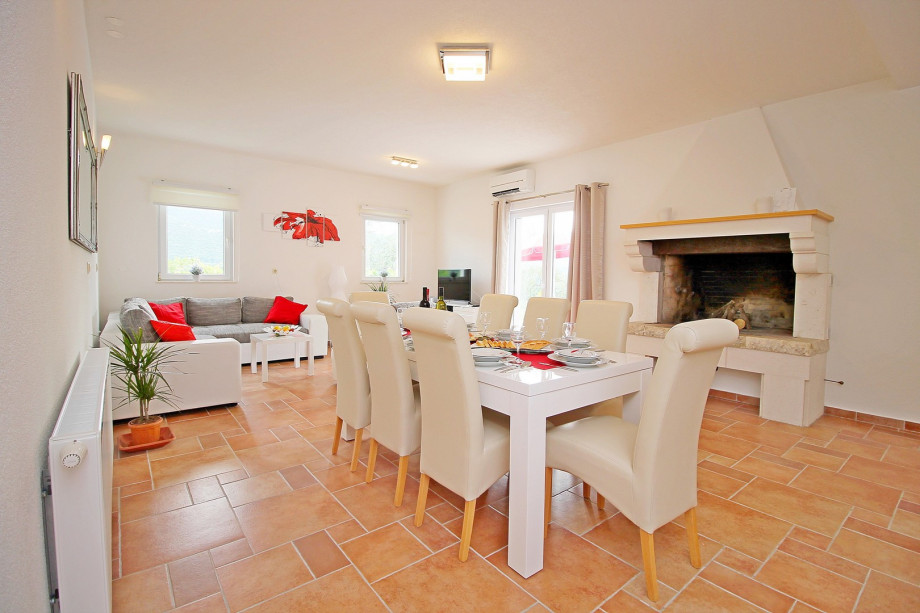 Dinning and living area with fully equipped kitchen and access to the pool