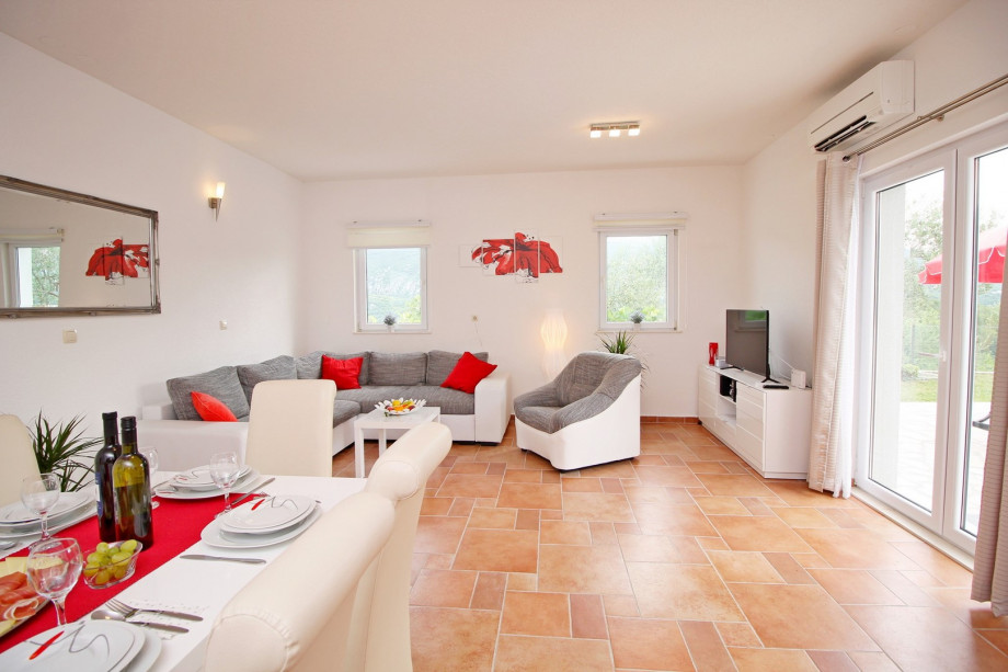 Dinning and living area with fully equipped kitchen and access to the pool