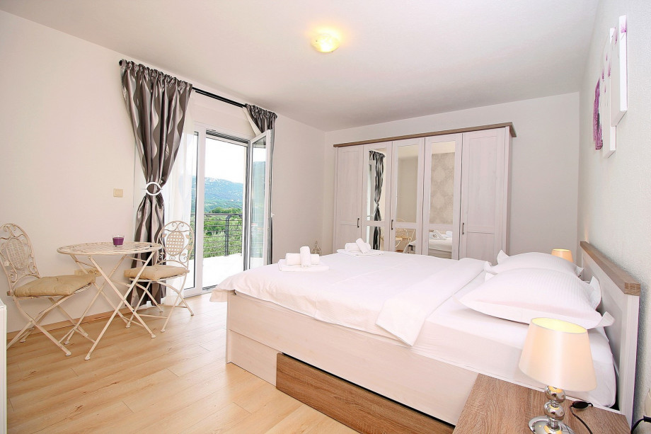 Bedroom No2 with double bed and exit to the terrace