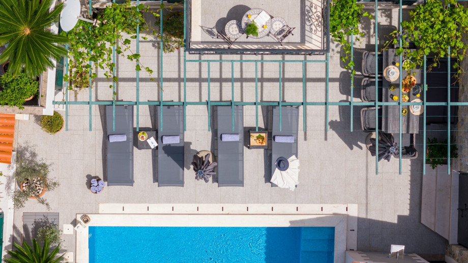 Sun deck area with deck chairs and parasol