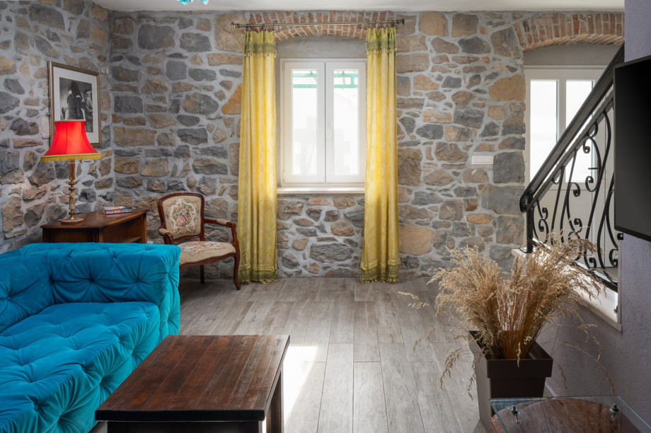 Few steps lower is a separate toilet and a washing machine