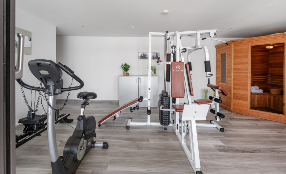 At pool level is a Sauna and a Gym with an exercise bike, a multifunctional machine, and rowing machine