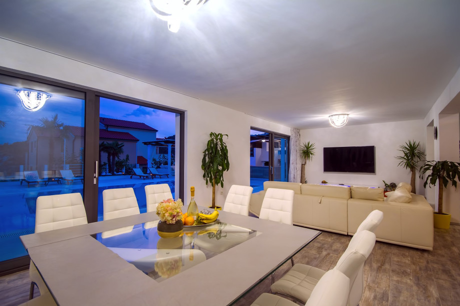 Beautiful dining and living room with night view on outside area