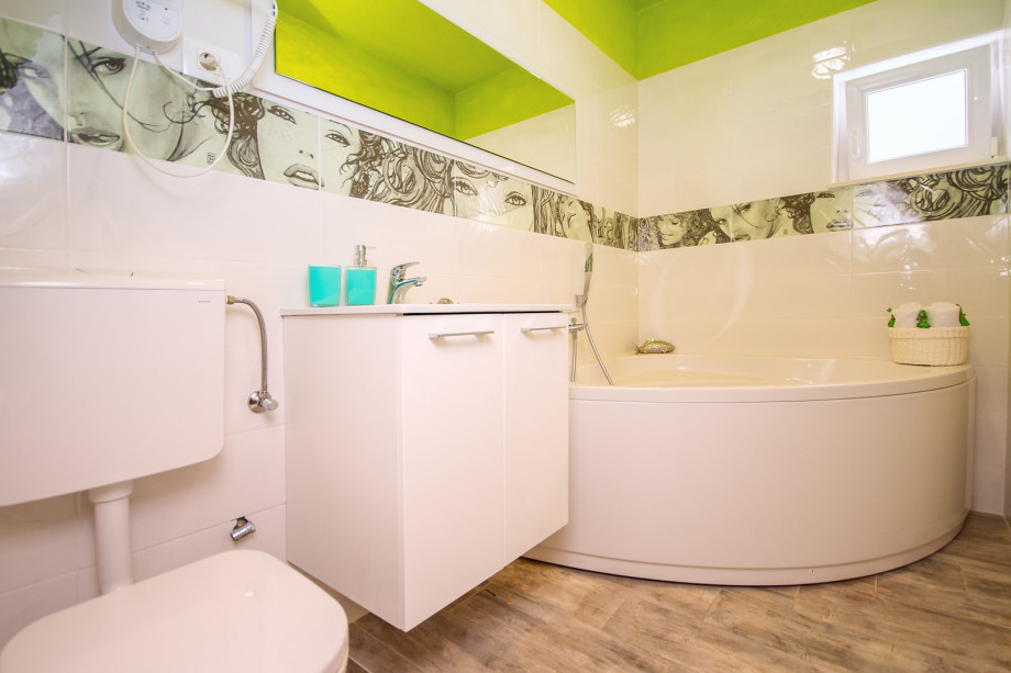 Family bathroom with a bathtub