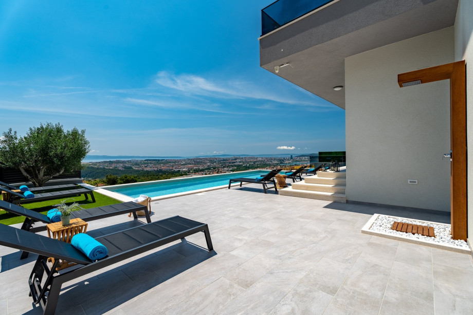 a private swimming pool 11m x 4m with hydro-massage, sun deck area with 8 deck chairs and an outdoor shower